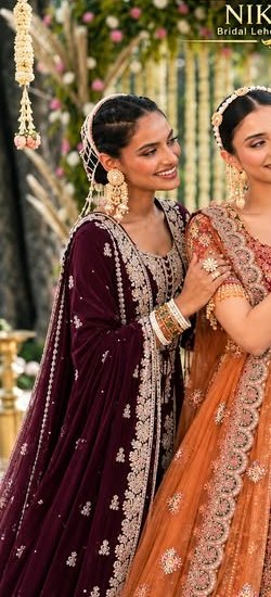 Bride in a wine velvet lehenga with zardozi buttis